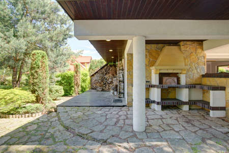 Fireplace is outside beautiful mansion in the suburbs