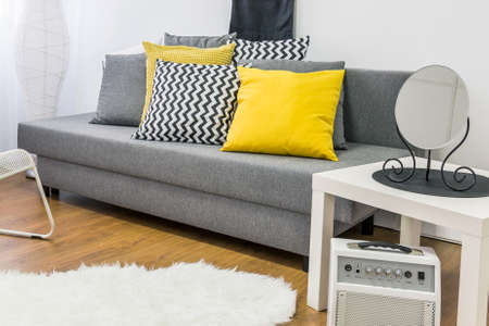 Shot of a modern grey and yellow living roomの写真素材