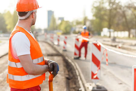Picture of strong construction worker at construction site