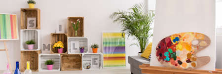 Shot of a colorful living room full of flowers and boxesの写真素材