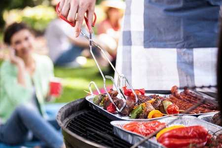 Preparing food for a vegetarian during barbecueの写真素材