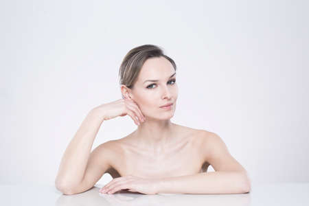 Shot of a young woman posing against a white backgroundの写真素材