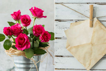 Bouquet of red roses in silver plant pot and white card in yellowed envelopeの写真素材