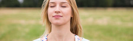 Close-up of woman resting close to natureの写真素材