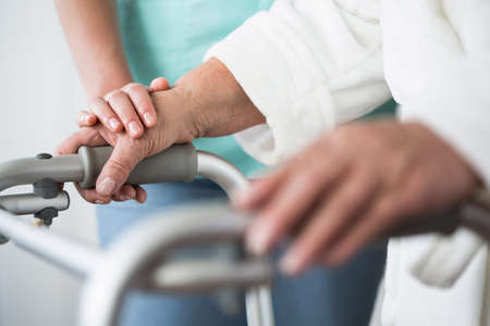 Close up of elderly person with walking zimmerの写真素材