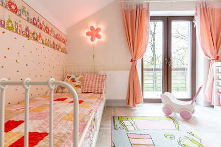 Shot of a spacious pink bedroom for a little girlのeditorial素材