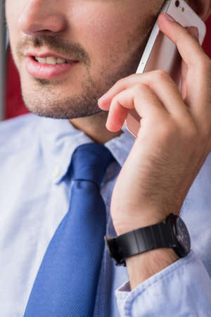 Young successful man has a telephone call