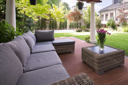 Close-up of comfortable sofa in the garden