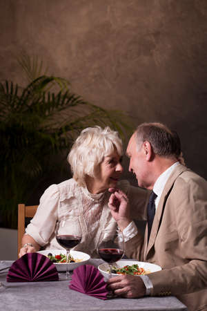 Shot of an elderly couple having a romantic dinner in a restaurantの写真素材
