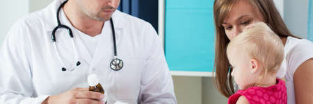 Mum and little daughter at pediatrician's officeの写真素材