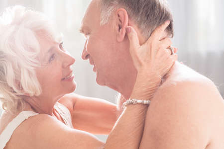 Senior woman looking with love at her husbandの写真素材