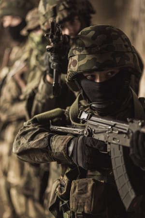 Group of armed soldiers during intense training exerciseの写真素材