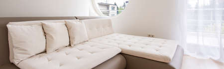 Panoramic picture of a big sofa in a modern houseの写真素材