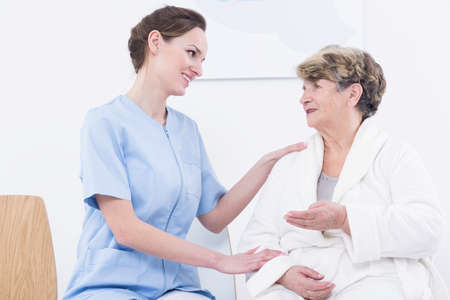 Shot of a smiling nurse supporting her patientの写真素材