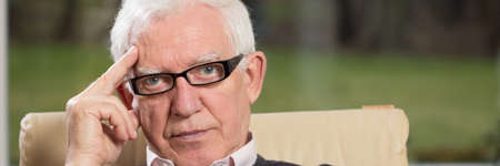 Portrait of practiced profesional elderly psychologist