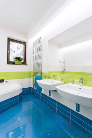 Shot of a spacious modern bathroom with two sinks and a corner bath