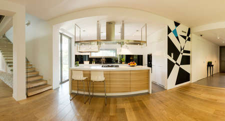 Very spacious ground floor of a contemporary house with a kitchen space and a kitchen island