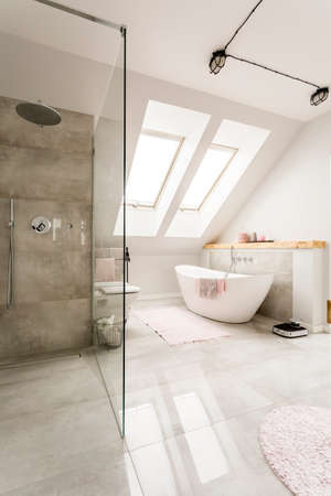 Spacious  new design  attic bathroom with glass walk in shower, bathroom and high gloss tiling