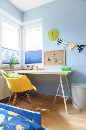 Shot of a desk in a colorful children's roomの写真素材