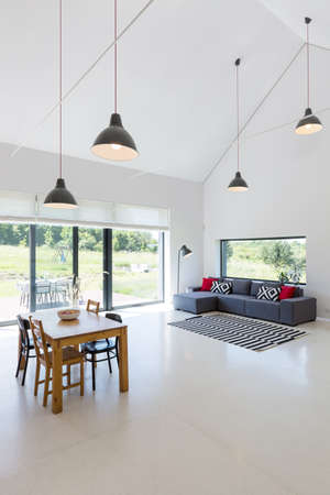 Shot of a modern living room combined with a dining areaの写真素材