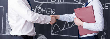 Panoramic picture of two business partners having a handshakeの写真素材