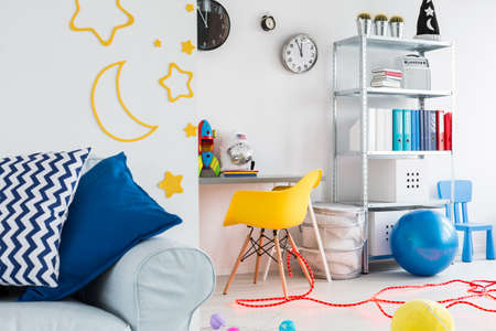 View on part of teenager room with place for work and couchの写真素材