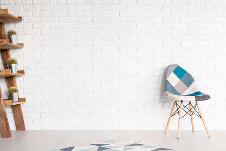 Shot of a modern interior with a patchwork chairの写真素材