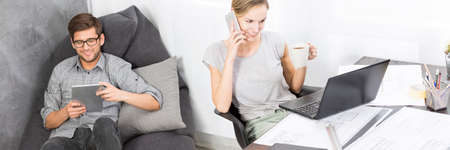 Young woman and man at creative workshop spaceの写真素材