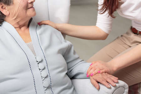 Cropped picture of a senior woman smiling to her daughterの写真素材