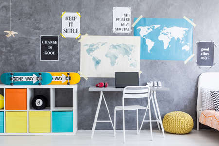 Shot of a minimalistic youth room interior with a gray wallsの写真素材