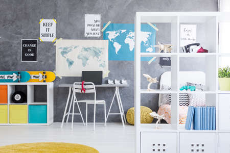 Shot of a teen bedroom interior with a minimalistic place to workの写真素材