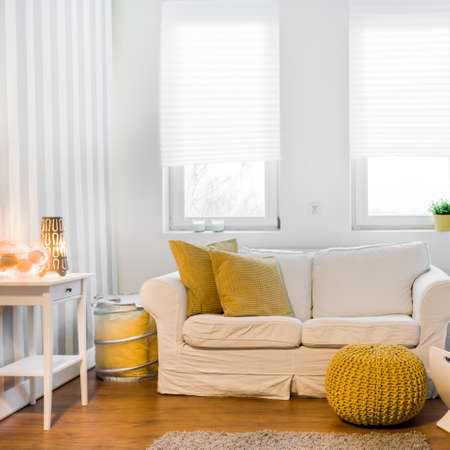 Cozy relaxation space with comfortable couch in modern spacious lounge