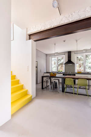 Shot of a spacious hallway and minimalistic open kitchen areaの写真素材
