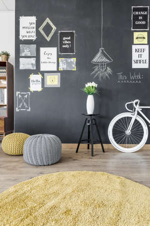 Modern home interior with blackboard wall and bikeの写真素材