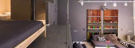 Entresol in modern house- upper level bedroom above living roomの写真素材