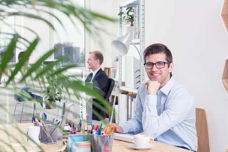 Shot of a happy office worker smiling at the camera