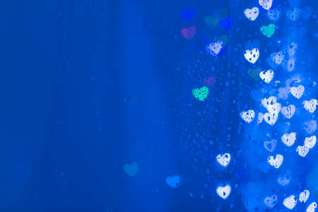 Love illumination- lovely heart shape lights through rainの写真素材