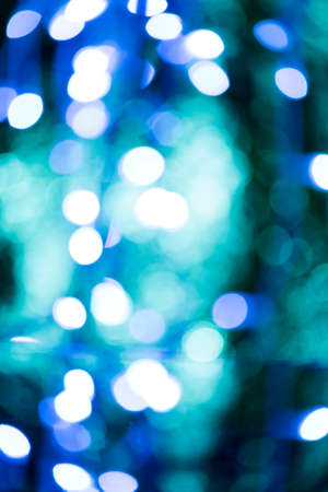 Blue and turquoise abstract image of white lightsの写真素材