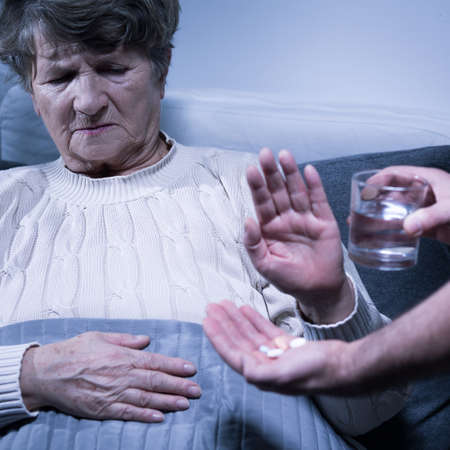 Shot of a senior woman refusing to take her medicationの写真素材