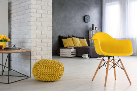 Modern loft design bedroom arrangement with yellow decorationsの写真素材