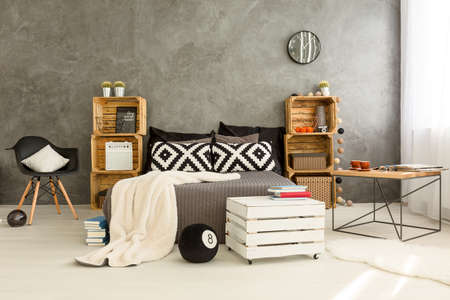 Eco creative bedroom idea with wooden crate shelvesの写真素材
