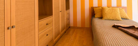 Closeup of a beautiful wooden furniture in a bedroom interiorの写真素材