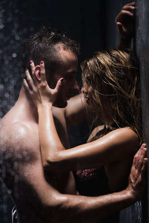 Sexy young pair embracing in the showerの写真素材
