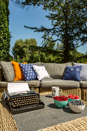 Image of villa terrace with rattan sofa and small tableの写真素材