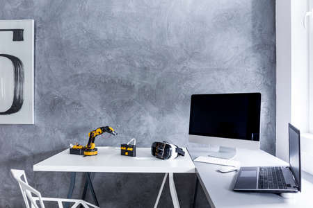 New study room with decorative wall plaster, white desk, crystal chair and computer