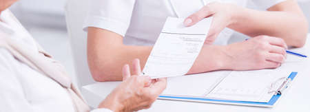 Panoramic picture of a patient receaving a prescription from a doctor