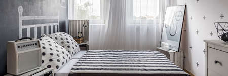 Inspiring urban bedroom interior in little studio flatの写真素材