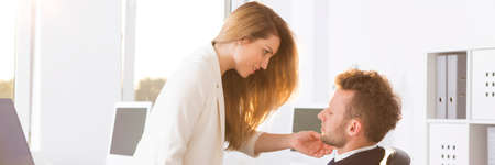 Attractive secretary flirting with her boss, panoramaの写真素材