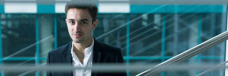 Handsome young graduate of economy college as a successful elegant businessman of companyの写真素材