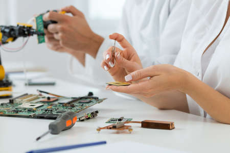 Cropped picture of an engineer working on a mainboard